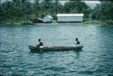 Coastline and Islanders in a canoe (1) : Bougainville Island, Papua New Guinea, 1960 / Terence and Margaret Spencer