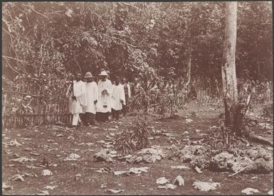 Clergymen and villagers during consecration of a graveyard at Tegua, Torres Islands, 1906 / J.W. Beattie