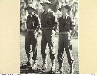 SIAR, NEW GUINEA. 1944-06-23. ORDERLY ROOM STAFF OF BATTALION HEADQUARTERS, 57/60TH INFANTRY BATTALION. IDENTIFIED PERSONNEL ARE:- VX84557 SERGEANT V.G. BARTER (1); VX81073 CAPTAIN R.M. MARTIN (2); ..