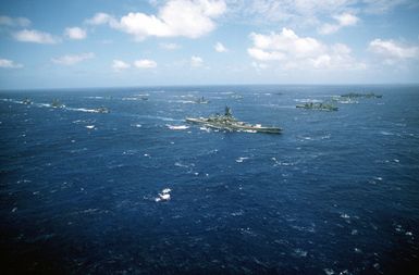 A starboard view of the battleship USS MISSOURI (BB-63) underway with its battle group during exercise RIMPAC '90 near Hawaii