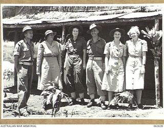 KOITAKI, NEW GUINEA. 1944-01-02. MEMBERS OF THE ADMINISTRATIVE STAFF OF THE 47TH AUSTRALIAN CAMP HOSPITAL. LEFT TO RIGHT: VX81139 MAJOR KENT HUGHES; VFX112001 MATRON H. E. M. MCMAHON; QFX25401 ..