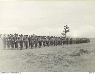 MARKHAM VALLEY, NEW GUINEA. 1944-08-28. PERSONNEL OF THE 4TH FIELD REGIMENT, MARCHING ON TO THE UNIT PARADE GROUND FOR AN INSPECTION BY THE GENERAL OFFICER COMMANDING, 3RD DIVISION