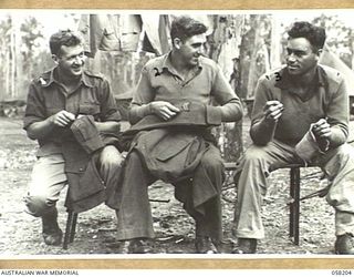 WONDECLA, QLD. 1943-10-06. TROOPS OF THE 17TH AUSTRALIAN INFANTRY BRIGADE, PREPARING FOR THEIR TROPICAL LEAVE, AFTER SERVICE IN NEW GUINEA. THEY ARE, LEFT TO RIGHT:- VX29276 CORPORAL K.R. POLLARD; ..