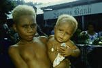 Tolai children [standing in front of] market branch of C'W [Commonwealth] Bank, [Rabaul,1962?]