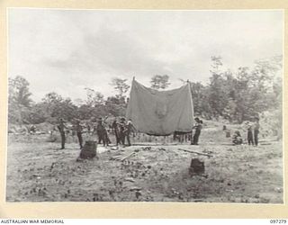 BUIN AREA, BOUGAINVILLE. 1945-09-13. MEMBERS OF THE AUSTRALIAN SURRENDER PARTY FROM HEADQUARTERS 2 CORPS, ERECTING A MARQUEE FOR GROUP CONFERENCES WITH THE JAPANESE. THE CONFERENCE IS BEING HELD AT ..