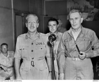 LAE, NEW GUINEA, 1945-12-25. THE RIGHT HONOURABLE J. B. CHIFLEY, PRIME MINISTER OF AUSTRALIA (3), MAJOR-GENERAL H. C. H. ROBERTSON, GENERAL OFFICER COMMANDING 6 DIVISION (1) AND LIEUTENANT T. DEAR, ..