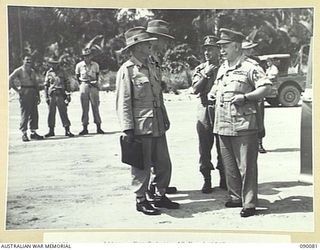 AITAPE, NEW GUINEA. 1945-03-19. GENERAL SIR THOMAS A. BLAMEY, COMMANDER-IN-CHIEF, ALLIED LAND FORCES, SOUTH WEST PACIFIC AREA (4), WITH MEMBERS OF THE OFFICIAL PARTY AT TADJI AIRSTRIP, ON A VISIT ..