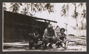 [Squatting in Front of Shed, #2]