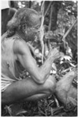 Folofo'u, secondary priest of Kwailala'e, with fire