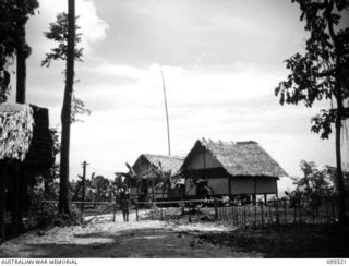 WUNUNG, JACQUINOT BAY, NEW BRITAIN, 1945-08-25. THE ENTRANCE TO THE ALLIED INTELLIGENCE BUREAU CAMP AREA
