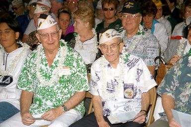 Survivors of the attack on Pearl Harbor, Mr. V.C. Clinnard and Mr. Hank A. Lachenmayer pose for a photograph at the at the USS Arizona Memorial Visitor Center, Pearl Harbor, HI. Both men were onboard the USS MARYLAND during the Pearl Harbor attack
