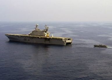 U.S. Navy Landing Craft Utility (LCU) 1658 (right), assigned to Assault Craft Unit 2, prepares to enter the well deck aboard the Tarawa Class Amphibious Assault Ship USS SAIPAN (LHA 2) after it successfully completed small boat operations in the Mediterranean Sea on Aug. 24, 2006. SAIPAN is currently underway conducting maritime security operations. (U.S. Navy photo by Mass Communication SPECIALIST SEAMAN Patrick W. Mullen III) (Released)