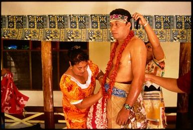 Matautia Ieriko Niulevaea being dressed for title bestowal ceremony, Utufa'alafa, Upolu, Samoa