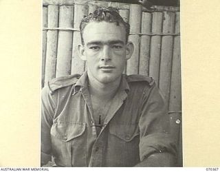 MILNE BAY, NEW GUINEA, 1944-01-11. QX46536 LANCE CORPORAL C.H. KENNEDY, DETACHMENT Z FIELD SECURITY SECTION, ATTACHED TO THE MILNE BAY BASE SUB AREA