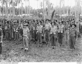 MADANG, NEW GUINEA. 1944-07-01. A JOIN-UP PHOTOGRAPH OF A MORNING PARADE OF THE 24TH INFANTRY BATTALION. TO JOIN TO PHOTOGRAPHS NO. 74438, 74439 AND 74441. IDENTIFIED PERSONNEL ARE:- PRIVATE D.A. ..