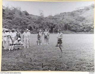 PORT MORESBY - WINNER OF 100 YARDS' DASH A.A.C. SPORTS, LIGHT TOO BAD TO ALLOW SPEED OF LENS SUFFICIENT TO STOP MOVEMENT IN FIGURE. DENSE OVERHANGING FOLIAGE. (NEGATIVE BY N. TRACY)