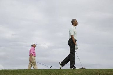 Barack Obama plays golf with Prime Minister Najib Razak, Joe Paulsen, and Mike Brush in Kaneohe Bay, Hawaii, December 24, 2014