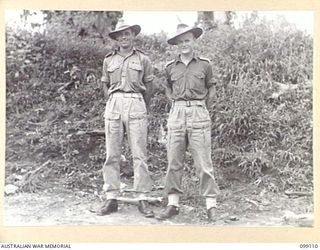 TOROKINA, BOUGAINVILLE. 1945-11-26. LIEUTENANT R.C. SARTORI (1) AND LIEUTENANT P.C.C. WERN (2), OFFICERS OF A COMPANY, 27 INFANTRY BATTALION