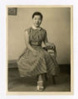 Portrait of woman sitting in chair