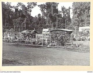 LAE AREA, NEW GUINEA. 1945-07-12. LIEUTENANT K.J. MCNAMARRA, OFFICER COMMANDING HEADQUARTERS 55 BULK ISSUE PETROL AND OIL DEPOT PLATOON, WHICH IS SUPPLIED BY 2 BULK PETROLEUM STORAGE COMPANY