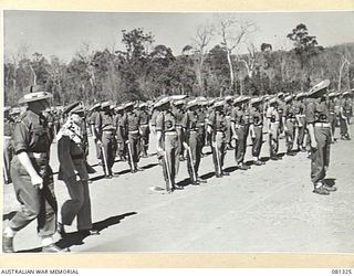 HERBERTON, QUEENSLAND, AUSTRALIA. 1944-10-11. VX17 MAJOR GENERAL J.E.S. STEVENS, DSO, ED, GOC 6TH DIVISION (2), ACCOMPANIED BY NX153 LIEUTENANT COLONEL N.W.P. FARRELL, COMMANDING OFFICER 2/4TH ..