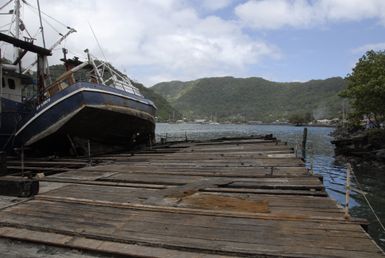 Earthquake ^ Tsunami - Pago Pago, American Samoa, October 1, 2009 -- Pago Pago, American Samoa, October 1, 2009 - A boat that was damaged by the recent tsunami sits on its side. FEMA/Casey Deshong