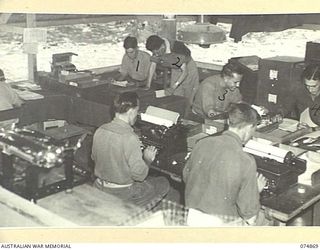 LAE-NADZAB, NEW GUINEA. 1944-07-20. THE INTERIOR OF THE GENERAL OFFICE OF THE CHIEF ENGINEER, HEADQUARTERS, NEW GUINEA FORCE. IDENTIFIED PERSONNEL ARE:- WARRANT OFFICER II, C. WEST (1); STAFF ..