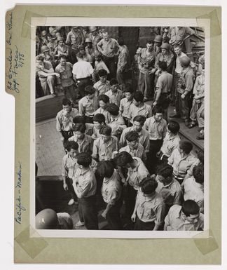 Photograph of Japanese and Korean Prisoners Standing on the Deck of a Coast Guard-manned Transport