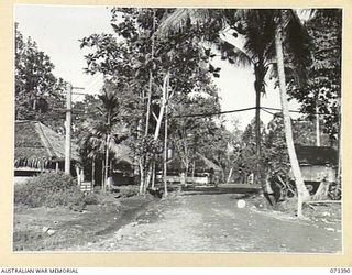 LAE, NEW GUINEA. 1944-05-23. THE ENTRANCE TO HEADQUARTERS NEW GUINEA FORCE. THE SIGNAL OFFICE IS LOCATED ON THE LEFT