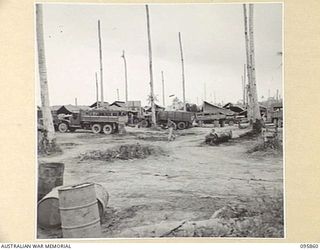 BORAM, WEWAK AREA, NEW GUINEA. 1945-08-31. TRUCKS IN FOR REPAIRS AT 2/41 LIGHT AID DETACHMENT, CORPS OF AUSTRALIAN ELECTRICAL AND MECHANICAL ENGINEERS