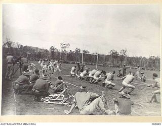 HERBERTON, QLD. 1945-01-19. THE 2 BEACH GROUP TEAM, (LEFT), LOSING IN THE FIRST PULL AGAINST DIVISION TROOPS A GROUP TEAM. THE MEN ARE PARTICIPATING IN THE TUG OF WAR 2ND SEMI FINAL DURING THE 9 ..