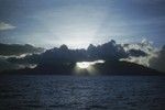 View of Moorea Islandat at sunset in French Polynesia in the South Pacific as seen from sea from one of the research ships during the Capricorn Expedition (1952-1953). January 17, 1953