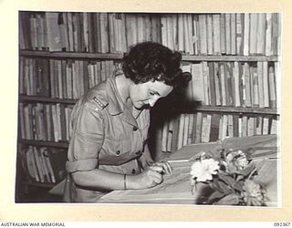 LAE, NEW GUINEA, 1945-05-23. SAPPER J. STREICHER, AWAS, UPDATING MAPS AT FIRST ARMY SURVEY. AWAS PERSONNEL ARE AT LAE TO RELEASE MEN OF HQ FIRST ARMY FOR DUTY IN FORWARD AREAS