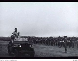 VUNAKANAU, NEW BRITAIN, 1946-02-12. FIRST FULL REGIMENTAL PARADE OF THE PACIFIC ISLANDS REGIMENT AS ONE COMPLETE UNIT. UNTIL THE WAR ENDED COMPANIES AND PLATOONS SERVED IN MANY DIFFERENT AREAS. ..