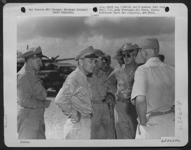 Lt. General Millard F. Harmon Chats With Fellow Officers During Short Visit To Saipan, Marianas Islands. They Are, Left To Right: Brig. General Martin F. Scanlon, General Harmon, Major General Elmer E. Adler And Brig. General Lawrence J. Carr. (U.S. Air Force Number 65360AC)