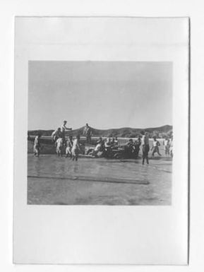 [Sailors Offloading a Vehicle from a Dinghy]