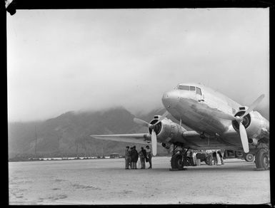 View of a C47 Dakota transport plane with unidentified USAAF personnel, Tafuna Airfield, American Samoa
