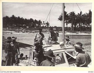 TOL PLANTATION, WIDE BAY, NEW BRITAIN. 1945-07-02. HIS ROYAL HIGHNESS, THE DUKE OF GLOUCESTER, GOVERNOR-GENERAL OF AUSTRALIA (2), AND HIS PARTY LEAVING TOL WHARF IN THE LAUNCH WHICH WILL TAKE THEM ..