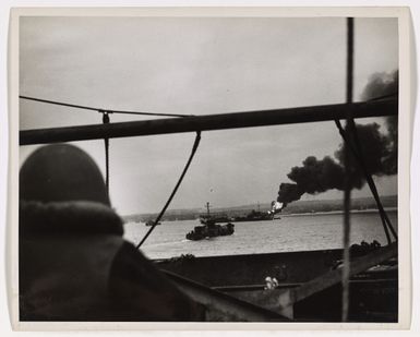 Photograph of a Crewman Watching a Flash of Flame Burst from the Bow of a Gasoline Barge