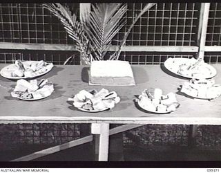 TOROKINA, BOUGAINVILLE, 1945-12-07. THE COOKERY SECTION AT THE ARTS AND CRAFTS EXHIBITION HELD AT TOROKINA. MANY OF THE ENTRANTS ARE STUDENTS AT THE TOROKINA REHABILITATION CENTRE