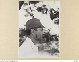 NAMANULA, NEW BRITAIN. 1945-10-18. MR HATTORI, A JAPANESE INTERPRETER FROM HEADQUARTERS 18 JAPANESE ARMY, WHO ACTED AS INTERPRETER TO LIEUTENANT GENERAL H. IMAMURA DURING THE SURRENDER ..