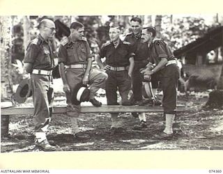 SIAR, NEW GUINEA. 1944-06-25. OFFICERS OF HEADQUARTERS, 57/60TH INFANTRY BATTALION. IDENTIFIED PERSONNEL ARE:- VX103304 CAPTAIN D.C.G. BRACKEN (1); VX108132 LIEUTENANT-COLONEL R.R. MARSTON, DSO, ..