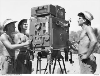 JACQUINOT BAY, NEW BRITAIN. 1944-11-17. VX64523 BOMBARDIER LAWRENCE (1), VX121777 GUNNER DELAHUNTY (2) AND VX126307 GUNNER R.S. COOK (3) OF THE 472ND HEAVY ANTI-AIRCRAFT TROOP, CHECKING A PREDICTOR ..