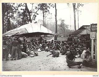JACQUINOT BAY, NEW BRITAIN, 1945-08-11. PERSONNEL OF HEADQUARTERS 11 DIVISION DEBUSSING AT 5 DIVISION RECEPTION CAMP. THEY ARE RELIEVING HEADQUARTERS 5 DIVISION TROOPS WHO ARE RETURNING TO THE ..