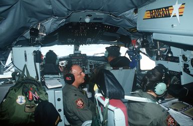 During a Dissimilar Air Combat Tactics (DACT) Exercise over the islands of Hawaii, members of the 203rd Air Refueling Squadron, Hawaii Air National Guard, prepare their KC-135 for refueling missions for the participants