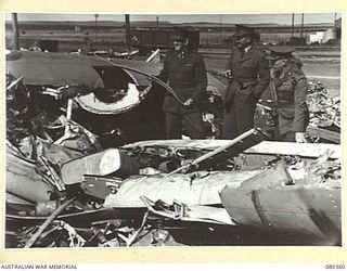 TEROWIE, SOUTH AUSTRALIA. 1944-09-13. OFFICERS AT HEADQUARTERS 4TH SALVAGE DEPOT, SOUTH AUSTRALIAN LINES OF COMMUNICATION AREA, INSPECT ROYAL AUSTRALIAN AIR FORCE AIRCRAFT PARTS SALVAGED FROM ..