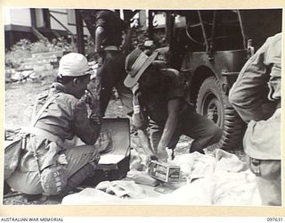 OCEAN ISLAND. 1945-10-02. FOLLOWING THE SURRENDER OF THE JAPANESE, TROOPS OF 31/51 INFANTRY BATTALION OCCUPIED THE ISLAND, AND JAPANESE TROOPS WERE EVACUATED TO TOROKINA. SHOWN, JAPANESE BEING ..