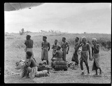 Group of local men, airstrip, Kavieng Island, New Ireland, Papua New Guinea