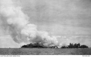 Samarai Island, New Guinea, March 1942. A view of the island after installations had been set on fire by Sergeants John Henry Marsh and Les Arnold of the New Guinea Air Warning Wireless Company ..