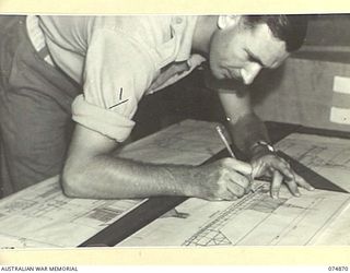 LAE-NADZAB, NEW GUINEA. 1944-07-20. VX60355 CORPORAL E.M. DAVIES, ARCHITECTURAL DRAUGHTSMAN, CHIEF ENGINEERS OFFICE, NEW GUINEA FORCE, WORKING ON THE PLANS FOR A NEW CHURCH TO BE ERECTED IN THE ..